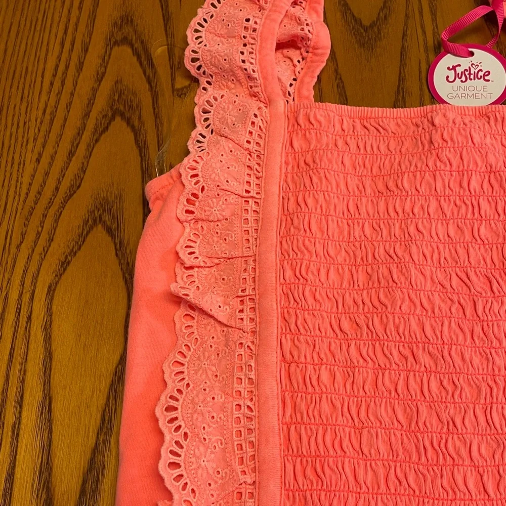 New Justice Girls orange smocked ruffle orange dye top. Size L 12/14